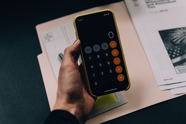 Calculator and keys representing pricing